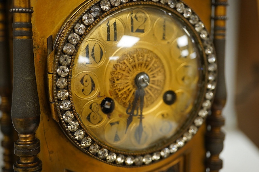 A late 19th century French brass mantel clock, 29cm high. Condition - fair.